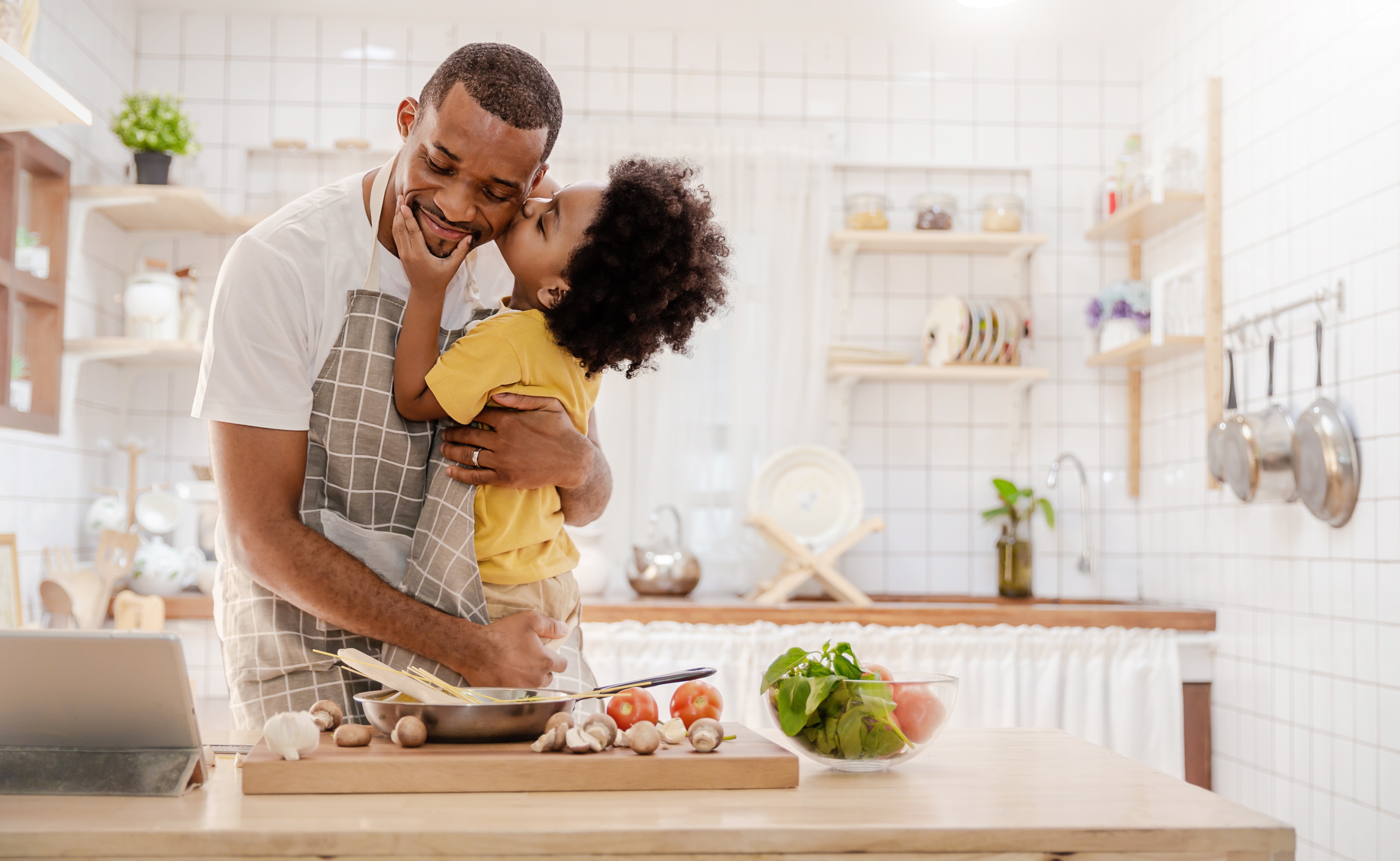 Father and son cooking together
