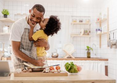 Father and son cooking together